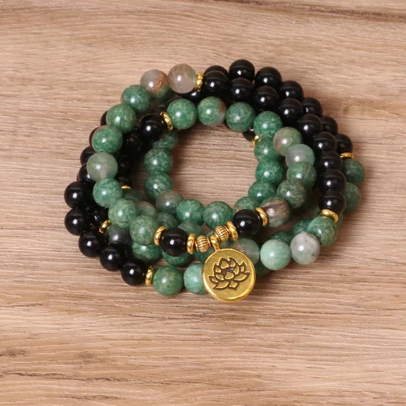 Green and black alloy beaded elastic bracelet with stretch band on wrist