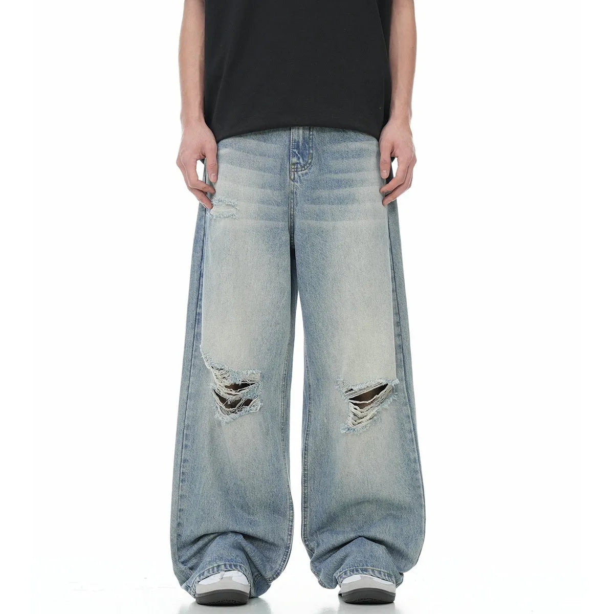 Blue men's straight-leg jeans with ripped detailing on the legs, showing a zipper fly.