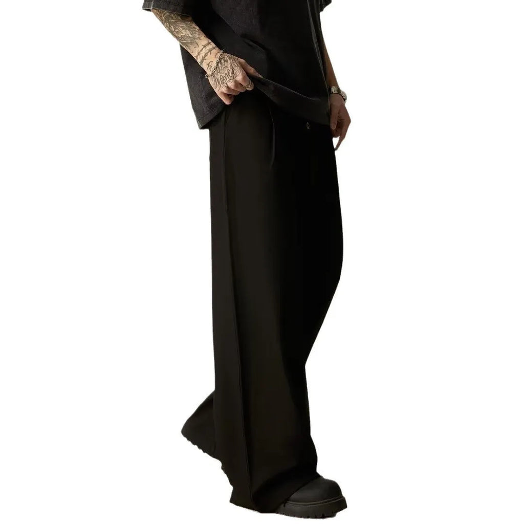 Men's black wide-leg tube trousers with button fly and straight-leg design on hanger