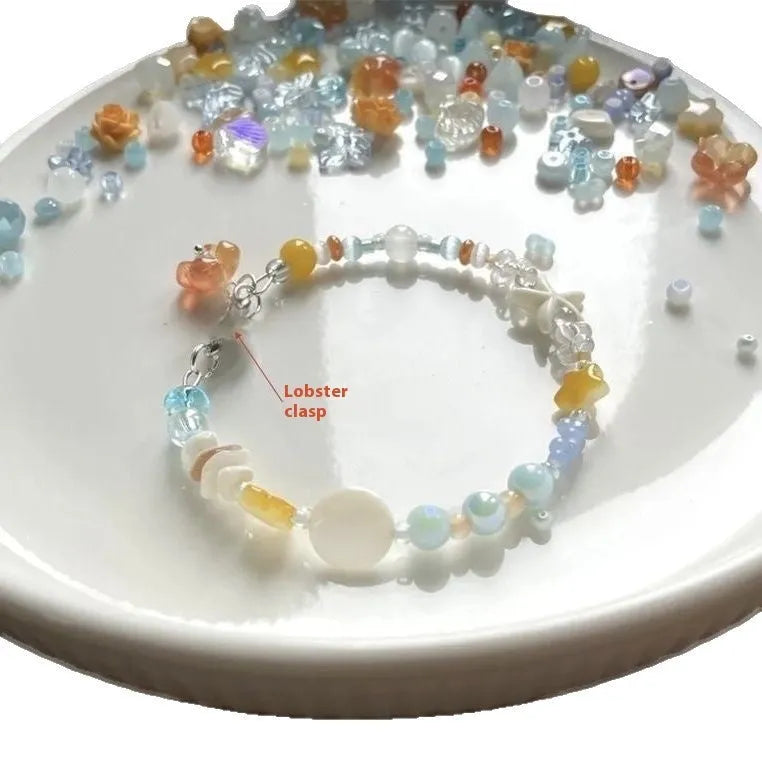 Orange alloy charm bracelet with mixed materials, diamond and round elements, adjustable seaside summer design