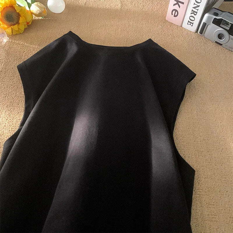 Men's loose cotton tank top in dark grey showing straight hem design and sleeveless construction