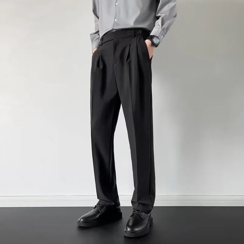 Men's straight-loose fit suit trousers in apricot colour hanging on a hanger.