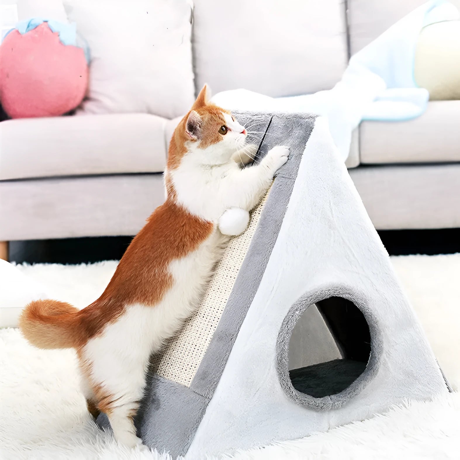 Grey and white triangle-shaped cat scratching post with an integrated plush fur bed for lounging.