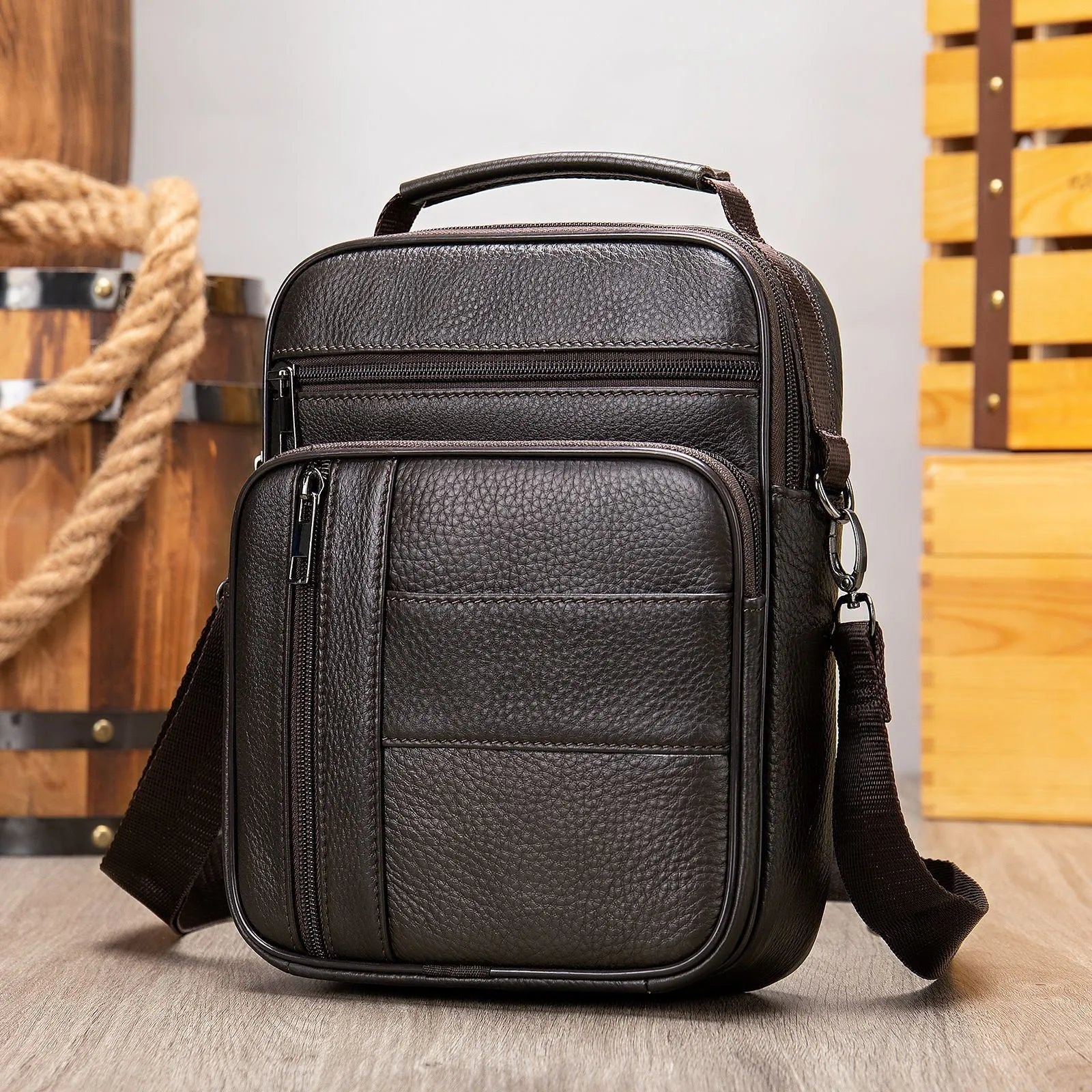 Genuine leather vintage men's shoulder bag in a vertical square shape, showing internal organiser pockets.