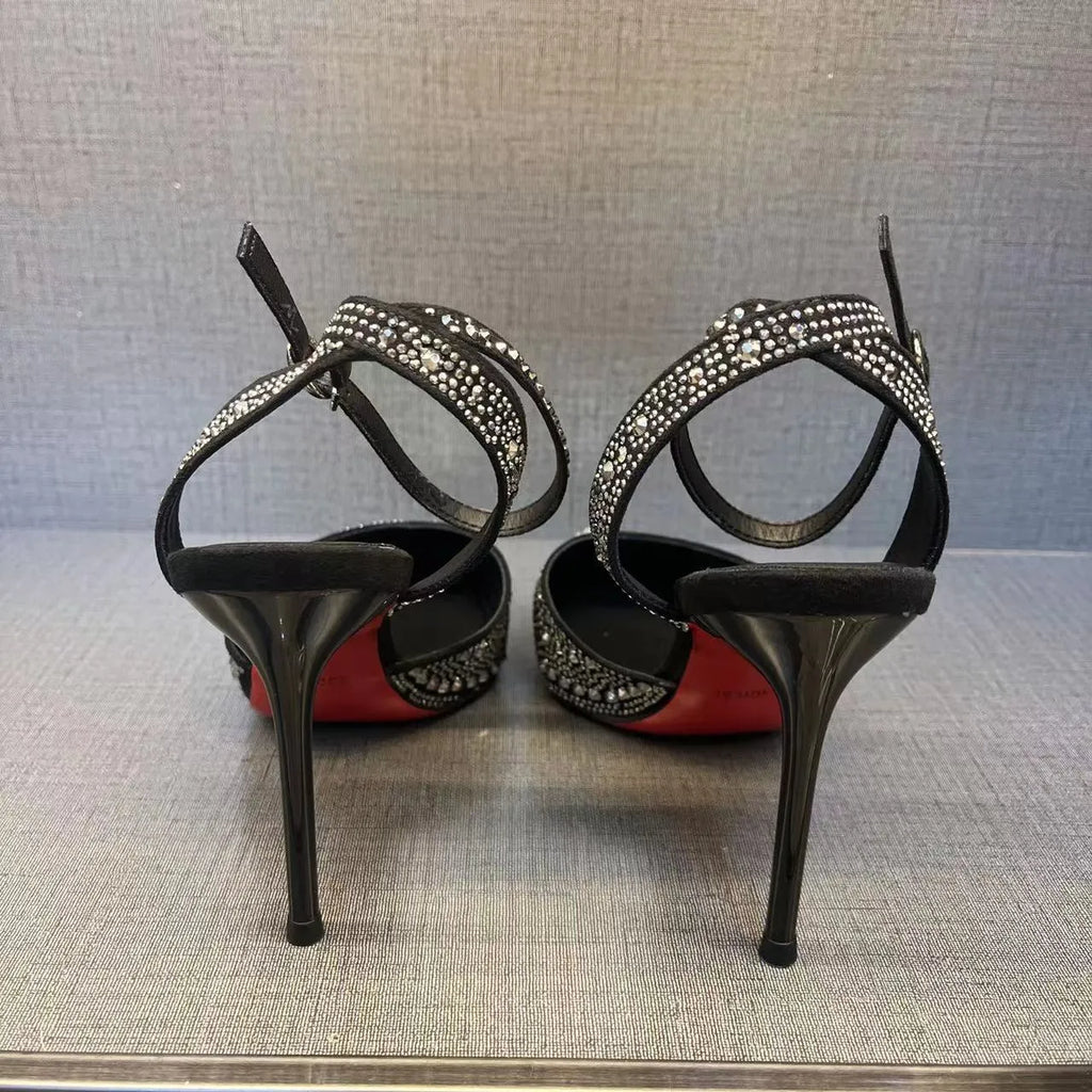 Women's silver hollow stiletto heels with pointed toe and red sole on white background
