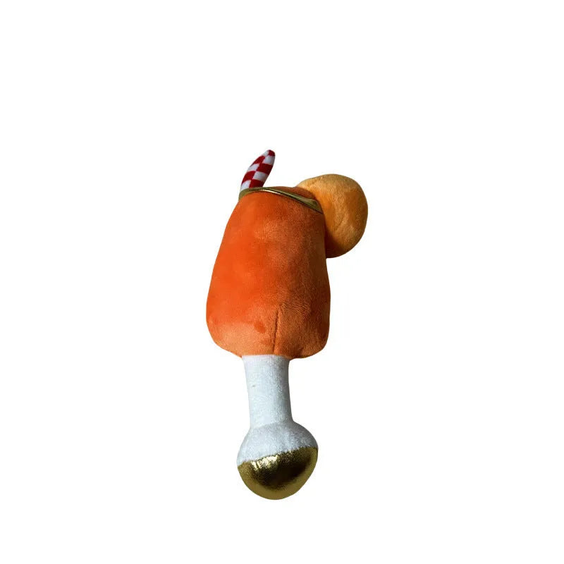 Yellow beer bottle shaped plush squeaky dog toy with cup handle on a white background.