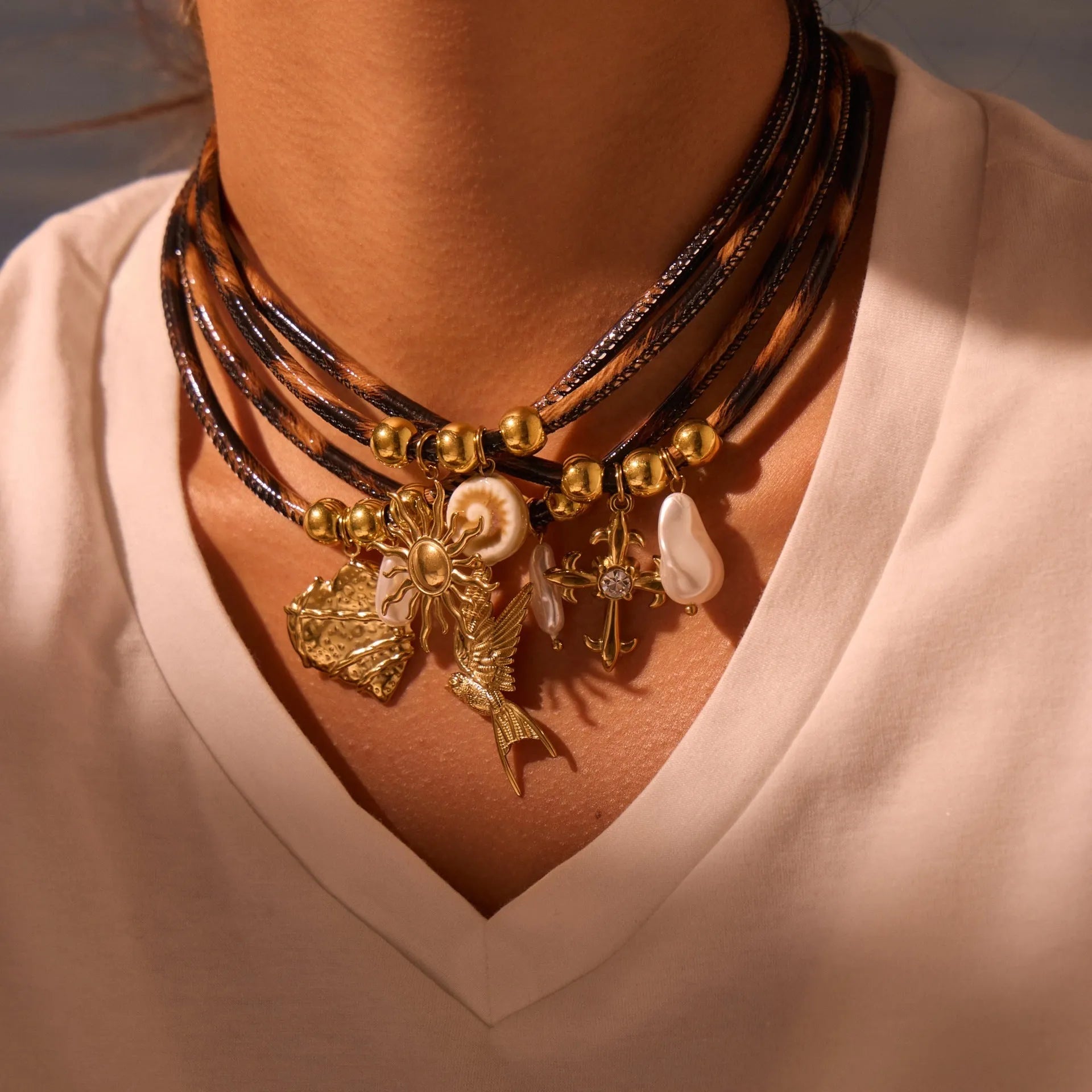 Geometric leopard pendant necklace on stainless steel chain with gold electroplated finish