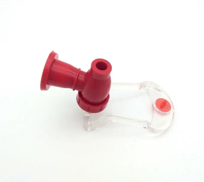 Red plastic Magic Tap soda dispenser attached to inverted 2 litre bottle
