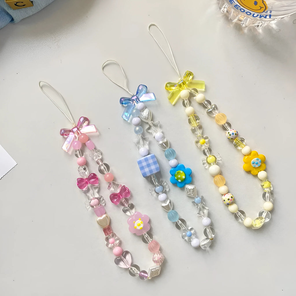 Beaded flower mobile phone lanyard with plastic resin floral decorations in yellow, blue, or pink colours