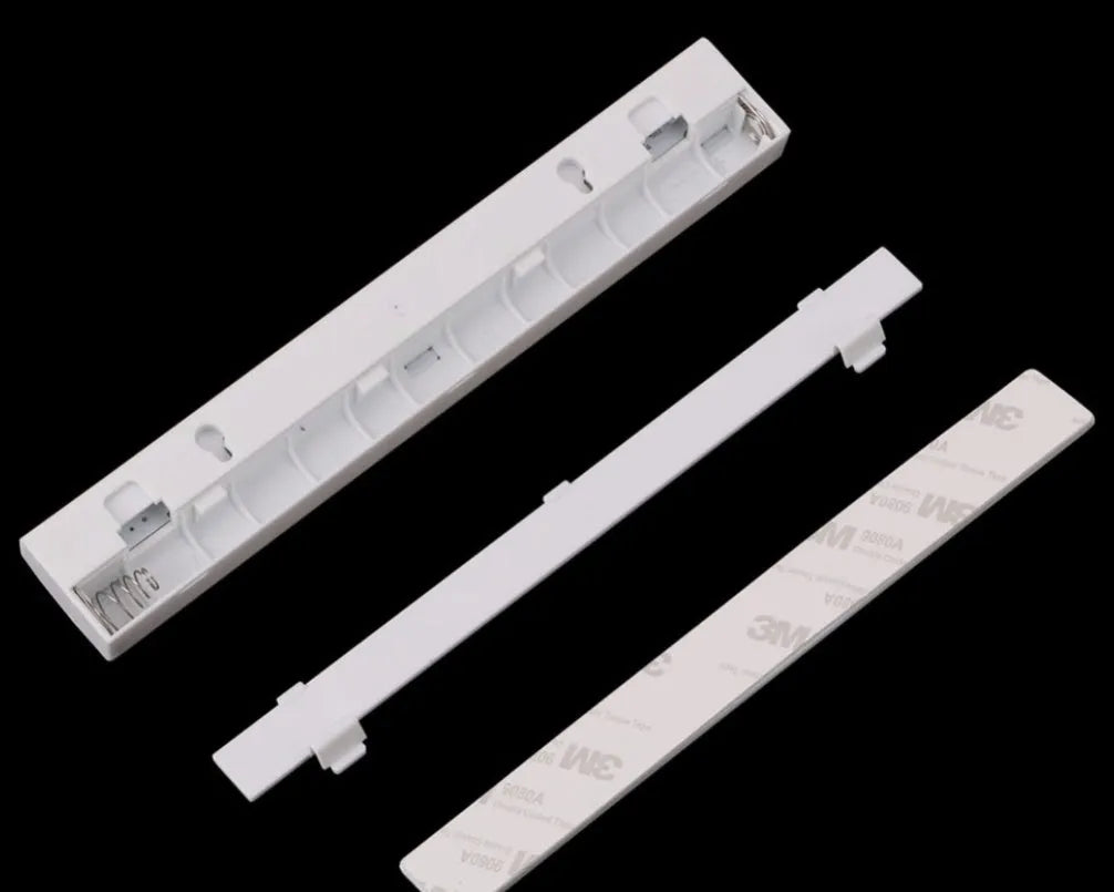 Silver aluminium LED closet light with magnetic back, shown illuminating a wardrobe interior.