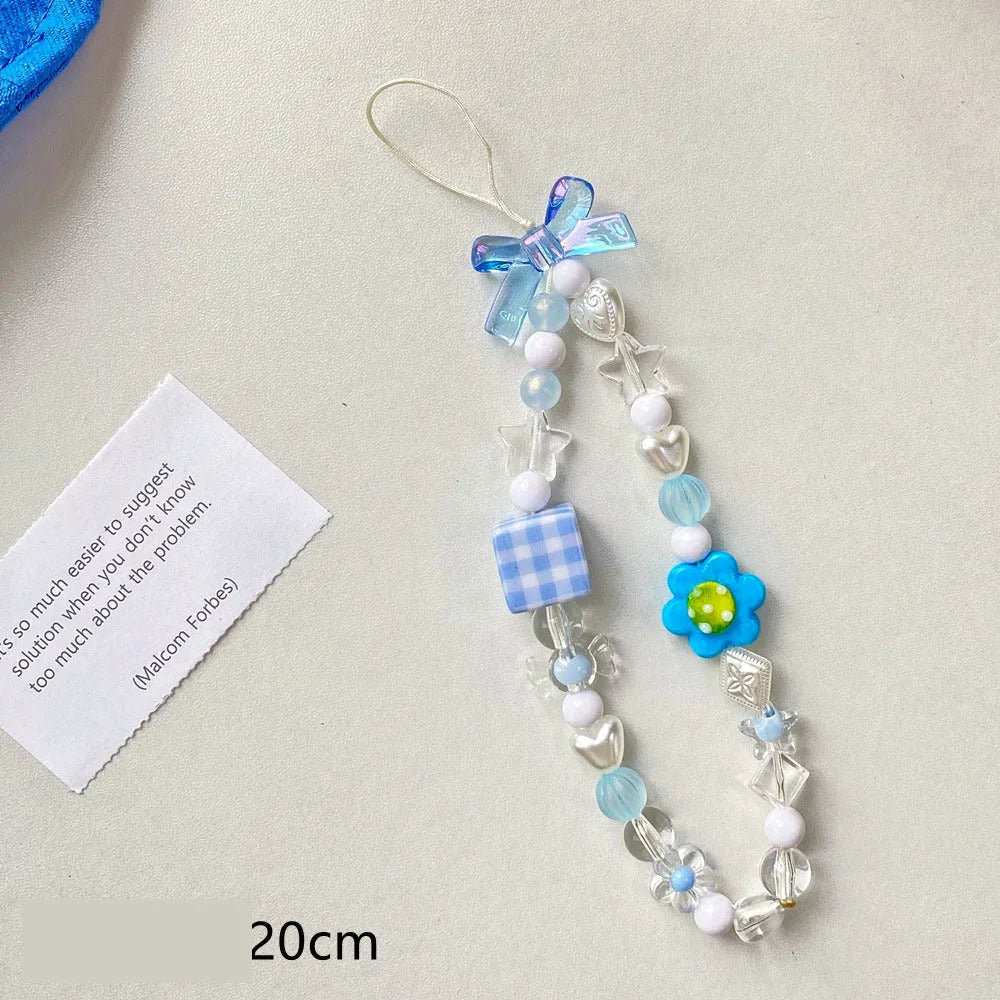 Beaded flower mobile phone lanyard with plastic resin floral decorations in yellow, blue, or pink colours