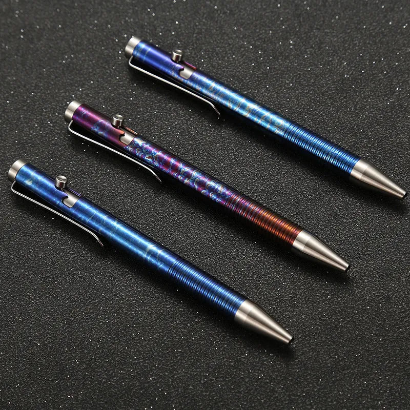 Titanium alloy ballpoint pen with gun bolt handle mechanism showing phantom colour finish variations