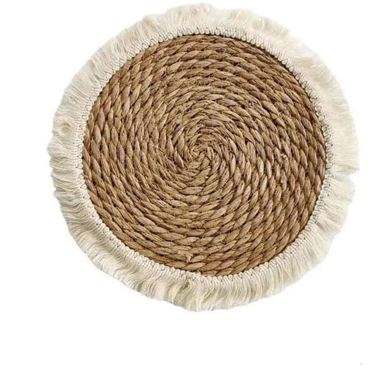 Round papyrus straw placemat with decorative tassels in modern solid colour design