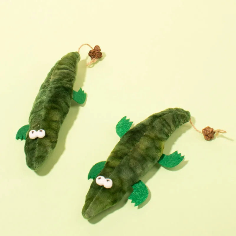 Green plush alligator cat toy with catnip and peppermint scent for oral cleansing