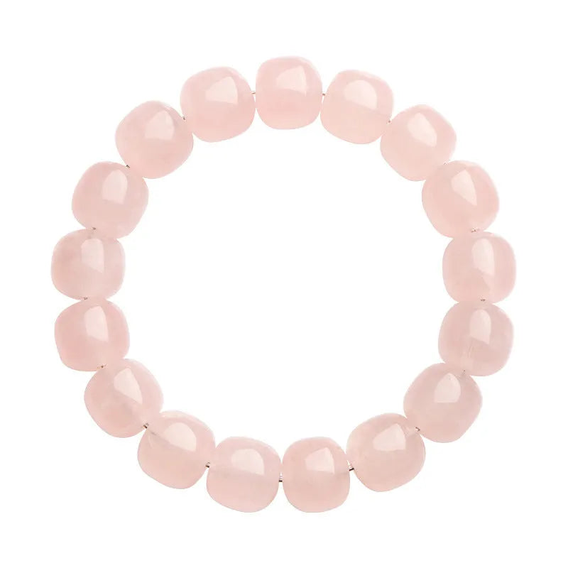 Pink natural crystal barrel bead bracelet with geometric 11mm x 12mm beads.