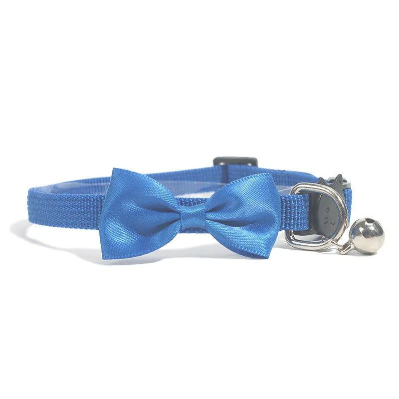 Adjustable nylon cat collar with decorative bow and bell in multiple colour options including red, blue, pink and green