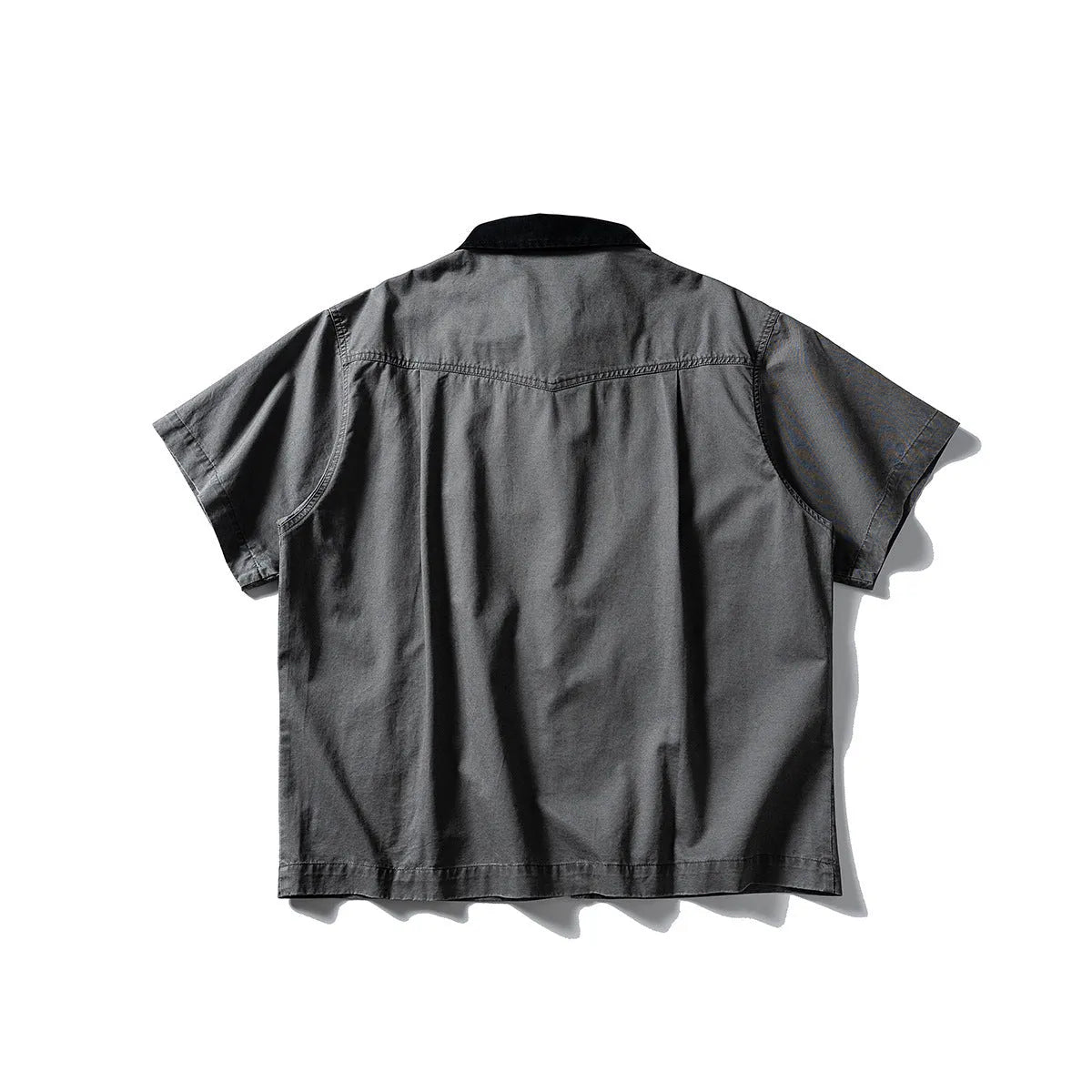 Short sleeve washed overalls shirt in a loose cardigan style, shown in khaki colour.