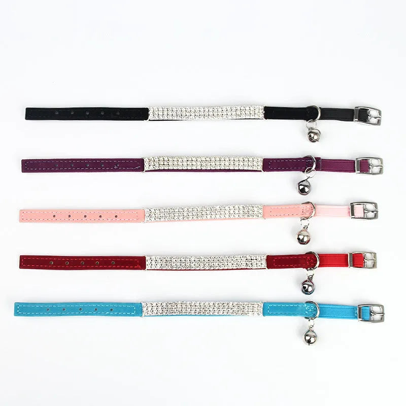 Red velvet cat collar with rhinestones, showing adjustable buckle set to 25cm length.