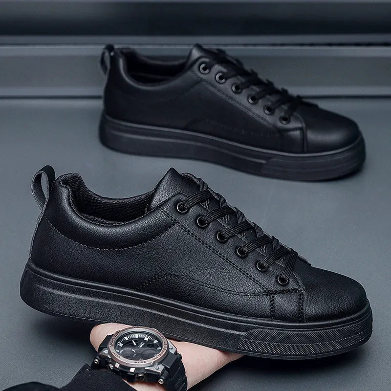 Men's low-top Korean-style sneakers in white and black colour options with round toe and flat rubber sole