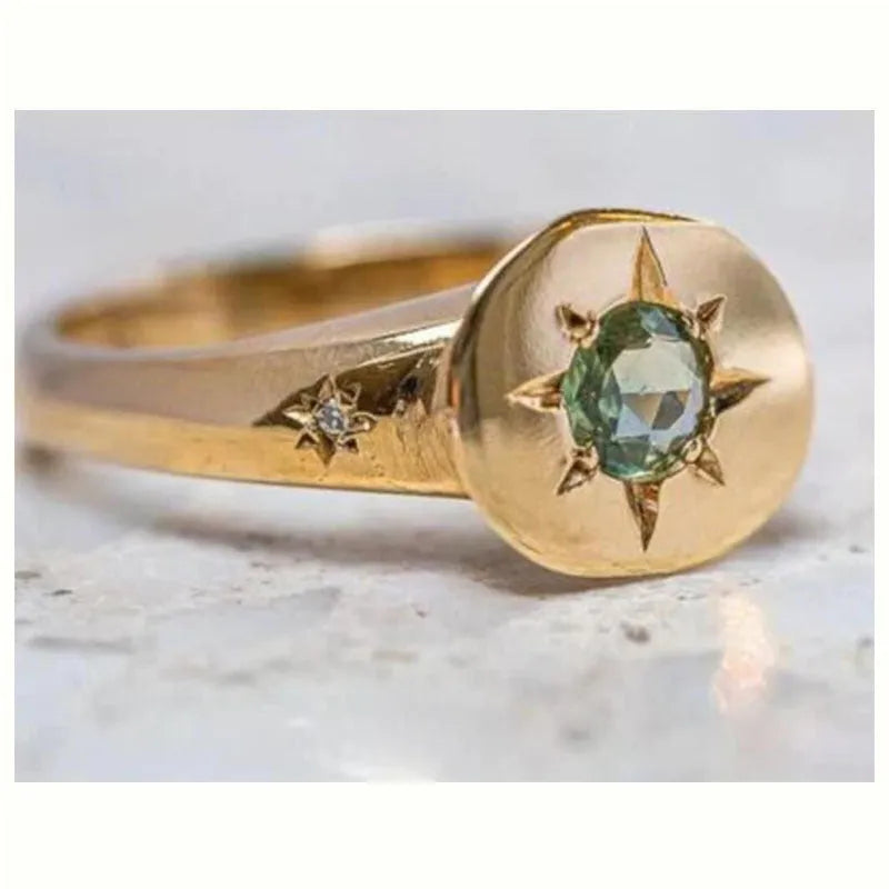 Golden adjustable ring with oval asterism zircon design and star shape