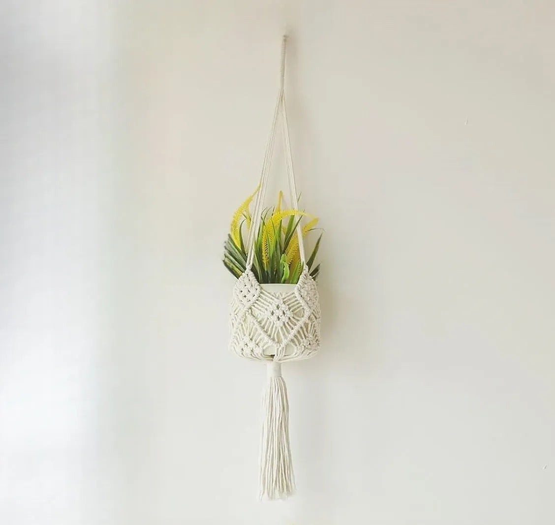 Hand-woven polyester cotton flower pot net pocket in brown, hanging with a green plant.