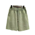 Men's loose-fit cotton casual shorts in distressed style, shown in charcoal black.