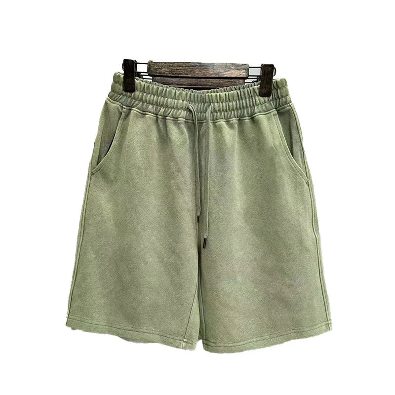 Men's loose-fit cotton casual shorts in distressed style, shown in charcoal black.