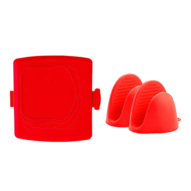 Red silicone baking tray with matching heat-resistant gloves on a kitchen counter.