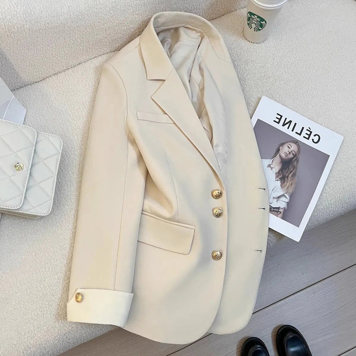 Women's Korean style loose fit polyester trench coat in milky white showing medium length and pocket details