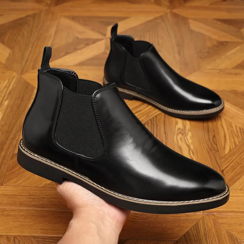 Black and brown formal pointed-toe leather boots with square heel and rubber sole.