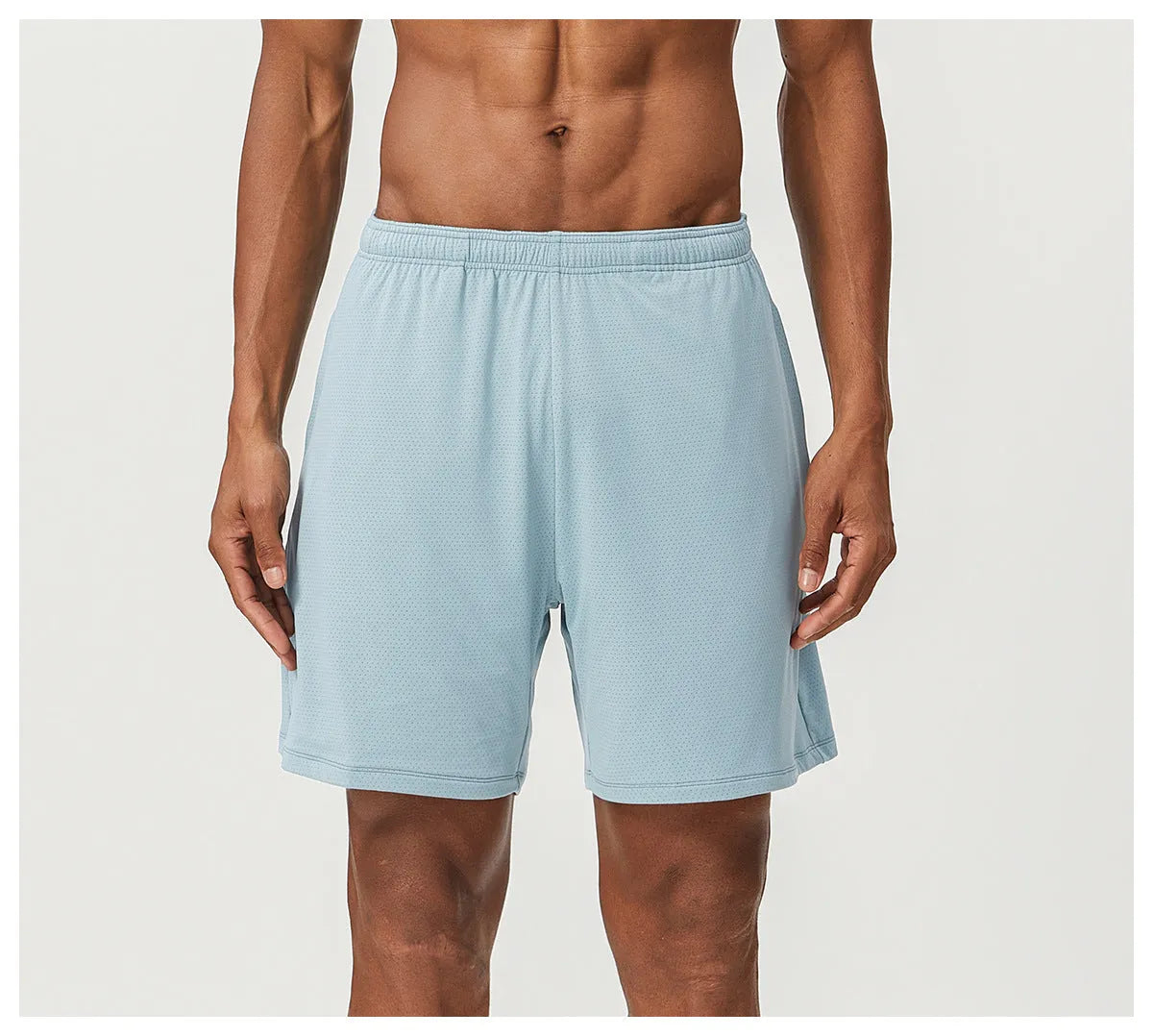 Man's quick-drying athletic shorts in khaki colour, showing double-layer construction and mid-waist fit.