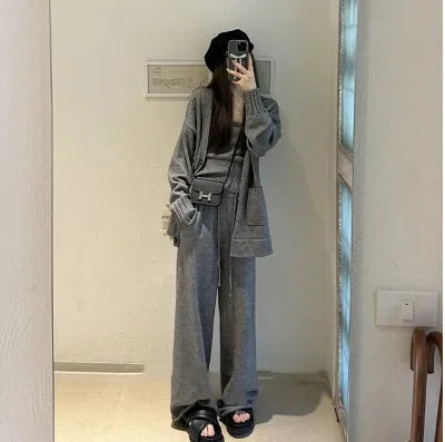 Women's loose fit knit cardigan, vest, and casual pants three-piece set in a solid colour.