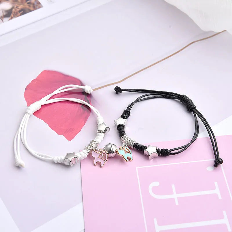 Alloy couple bracelets with magnet closure showing various design options including crown, clover, and text patterns