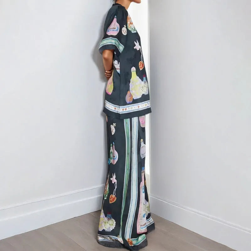 Black women's casual set with cartoon pattern featuring cardigan-sleeve top and matching trousers