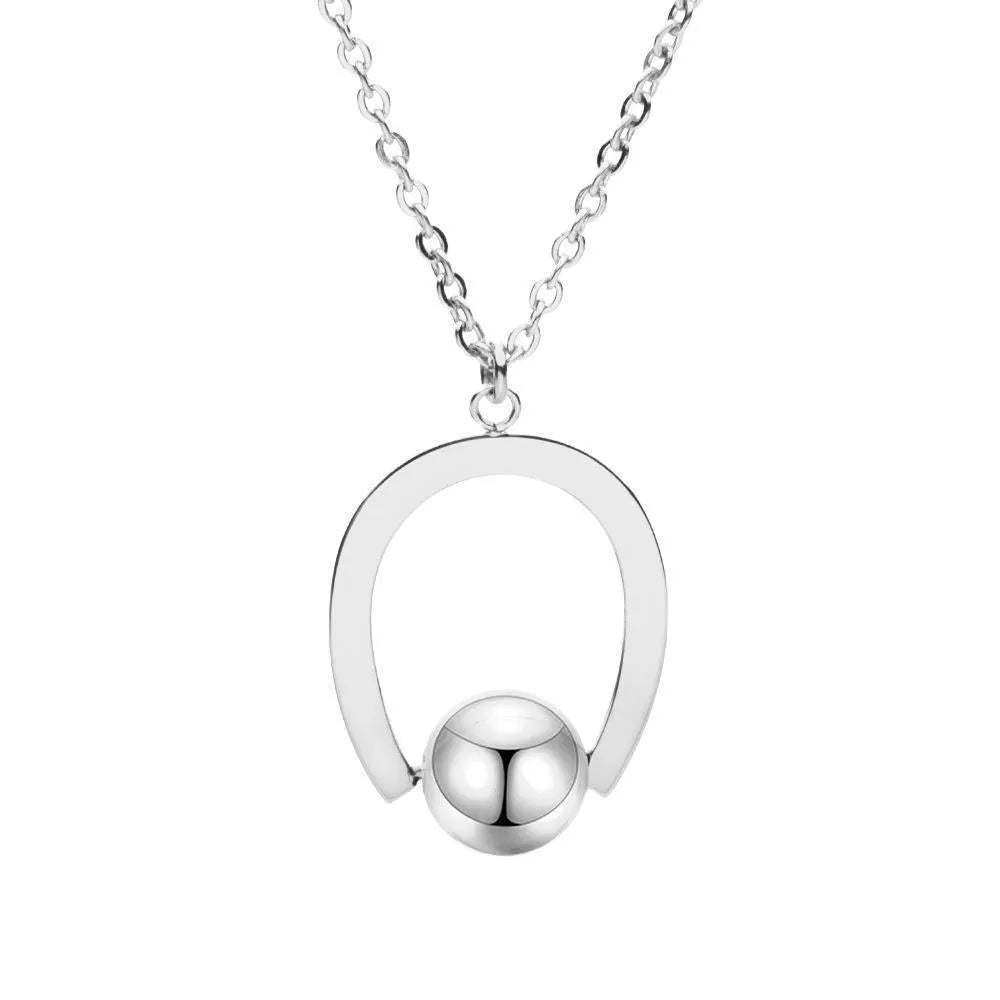 Stainless steel necklace with geometric pendant on a cross chain, in gold or silver colour.