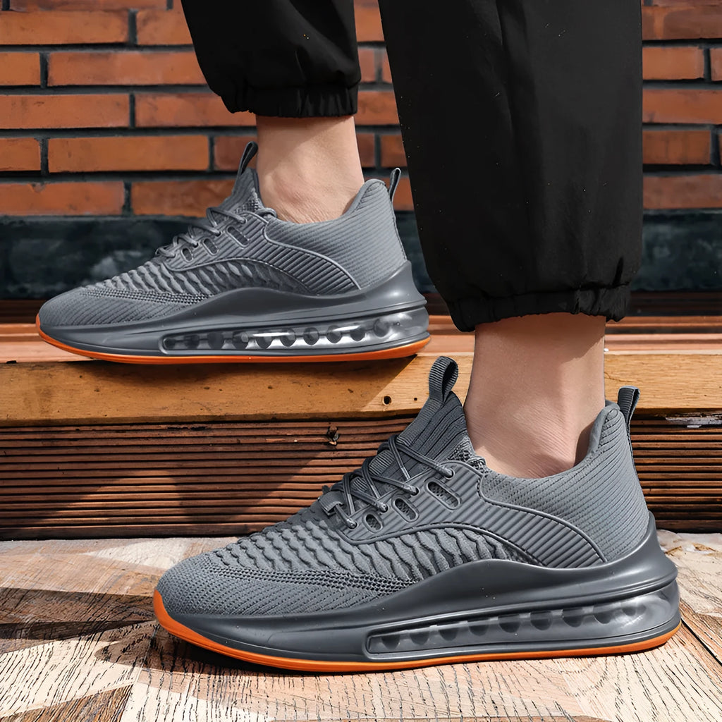 Men's low-top black mesh running shoes with lace-up front and rubber sole.