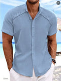Men's solid colour short sleeve casual shirt in cotton blend fabric on a hanger.