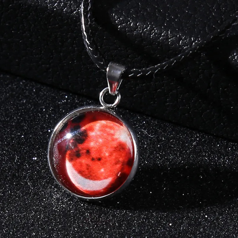 Alloy necklace with luminous glass pendant showing Christmas moon night sky and constellation design.