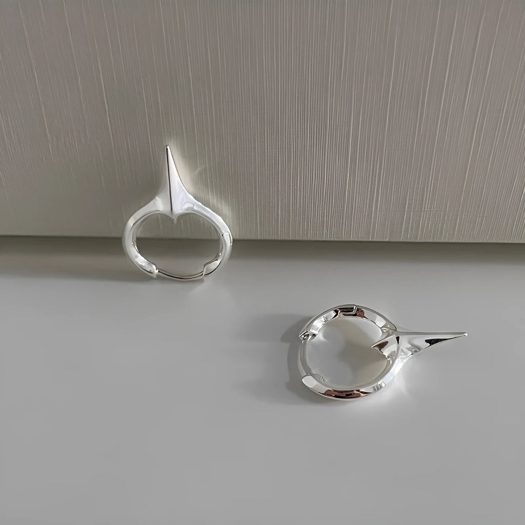 Geometric star shaped ear clips for women with copper construction and platinum electroplated finish