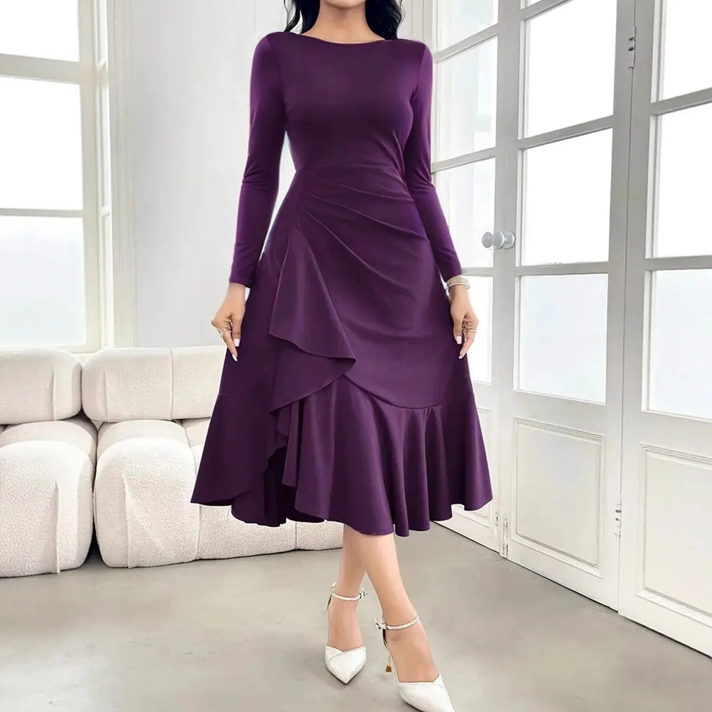 Purple women's dress with long sleeves, round neck, and ruffle detailing.