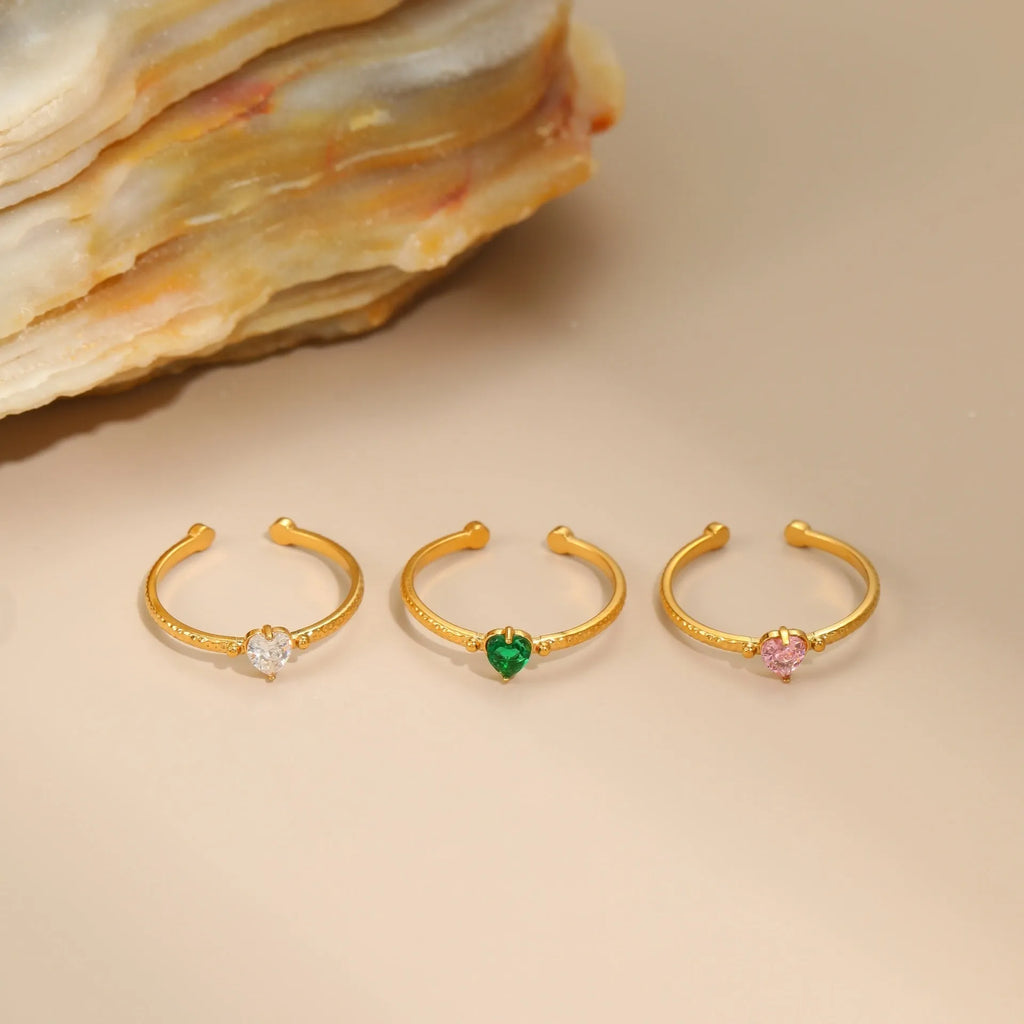 Geometric open-ended ring with heart-shaped zircon inlay in stainless steel