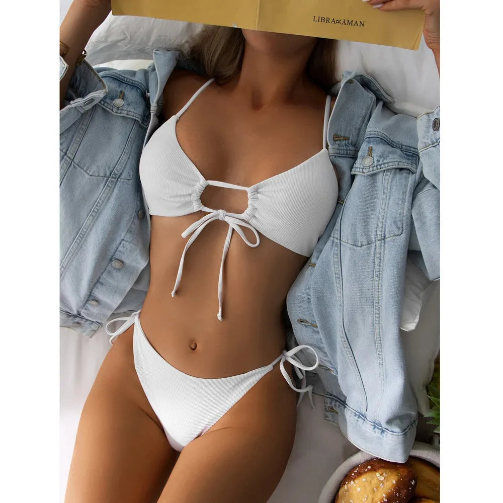 Women's solid color drawstring bikini set in backless brief style made of quick-drying nylon and spandex