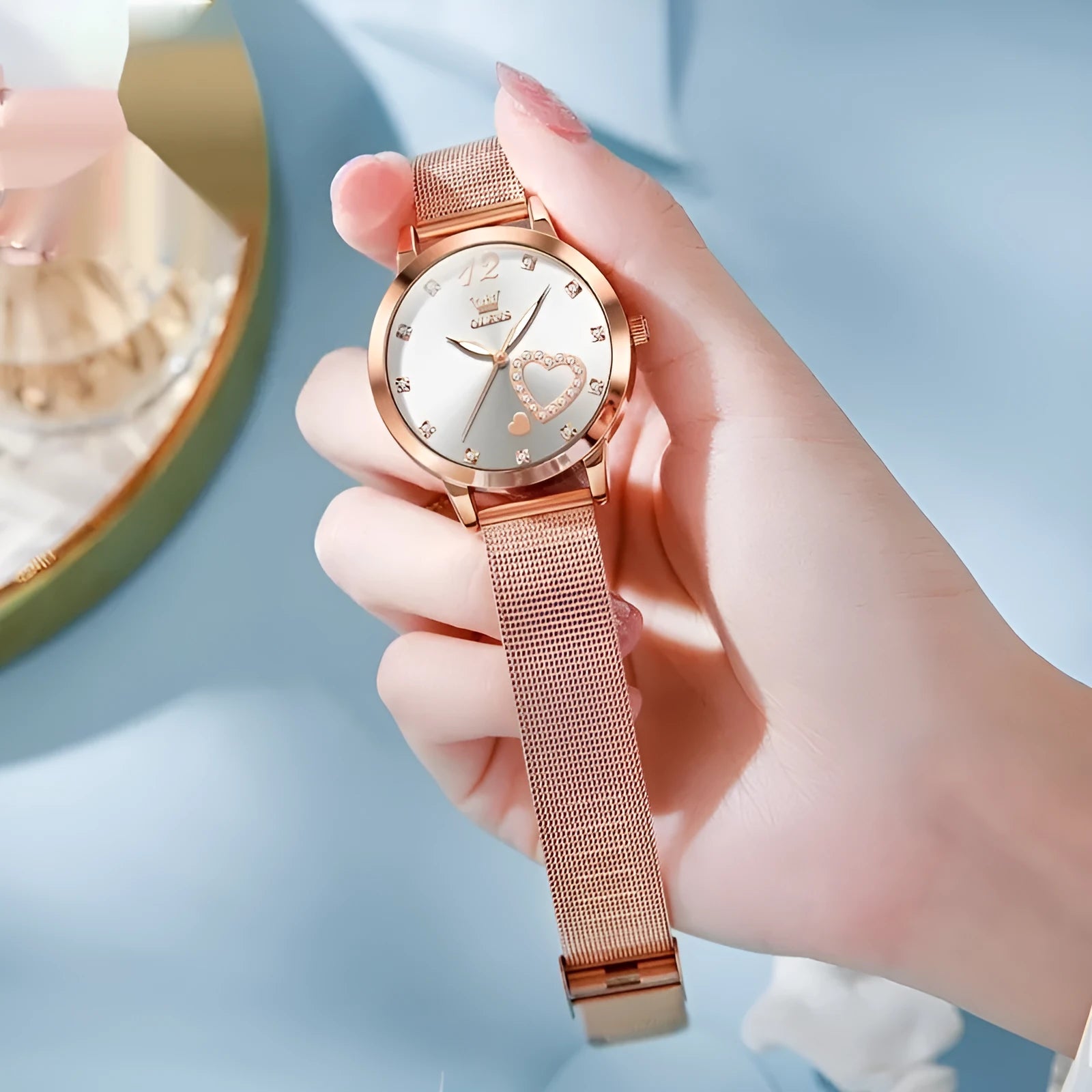 Women's fashion watch with rose gold mesh strap showing six dial colour options: white, black, blue, red, pink, green.