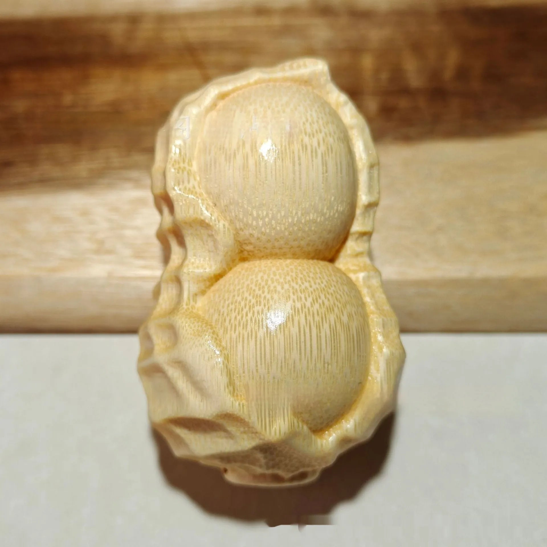 Solid bamboo peanut ornament carving with May Good Things Happen message