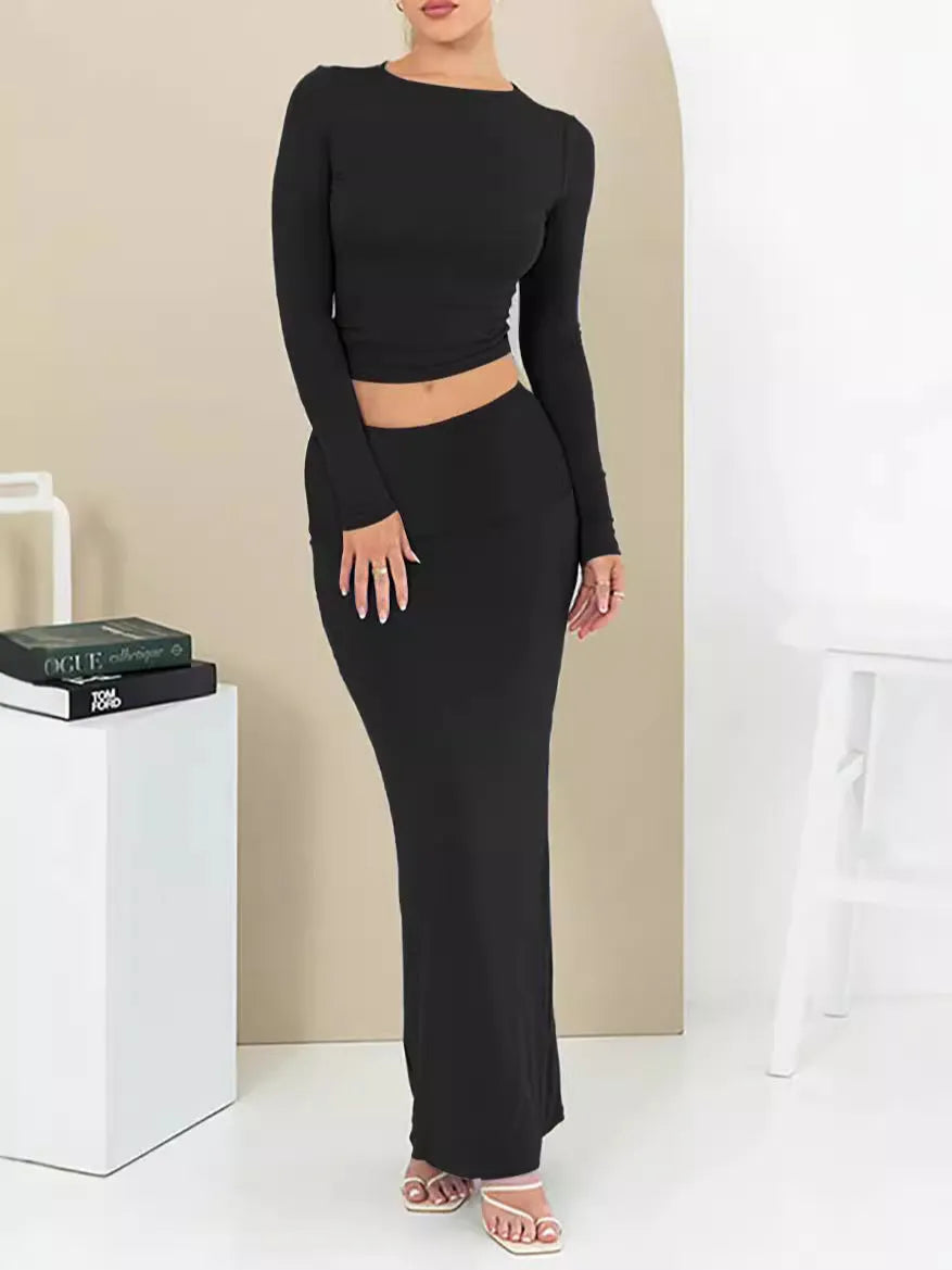 Women's black sweet style polyester two-piece suit with exposed navel and three-quarter sleeves.