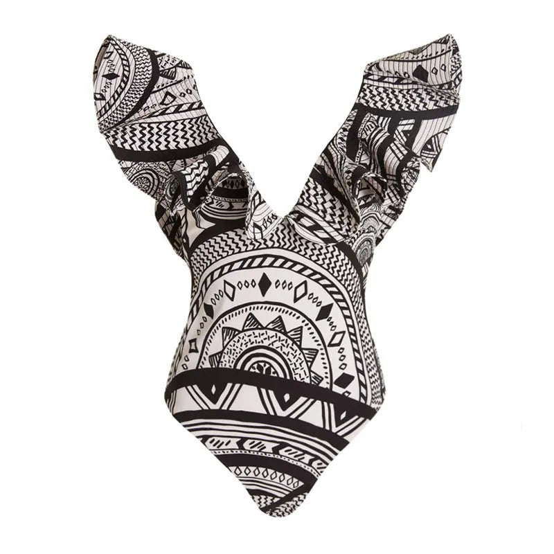 Women's vintage print one-piece swimsuit with deep V-neck and matching wrap skirt on a hanger.