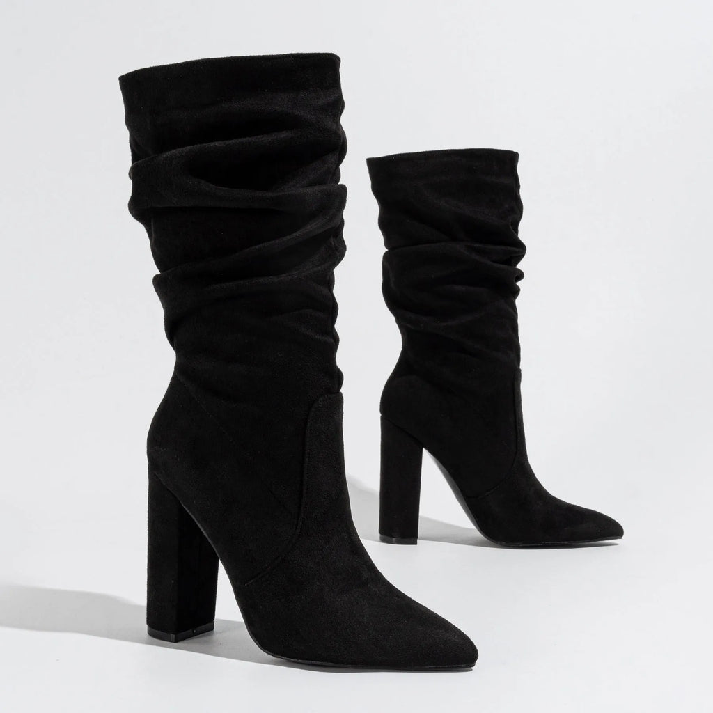 Women's black suede chunky heel pointed toe boots with super high heels and mid-calf length