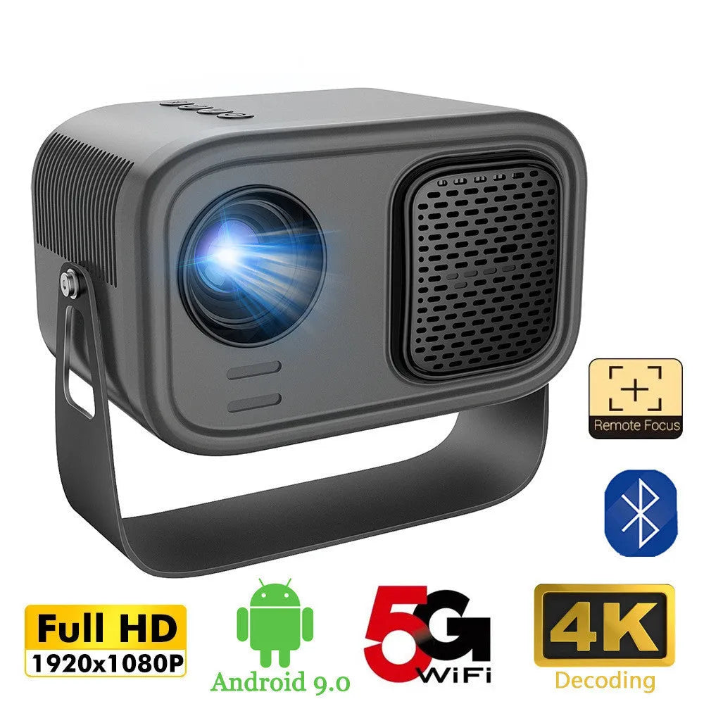 Black HD portable projector with Android system, remote control, and cables on desk