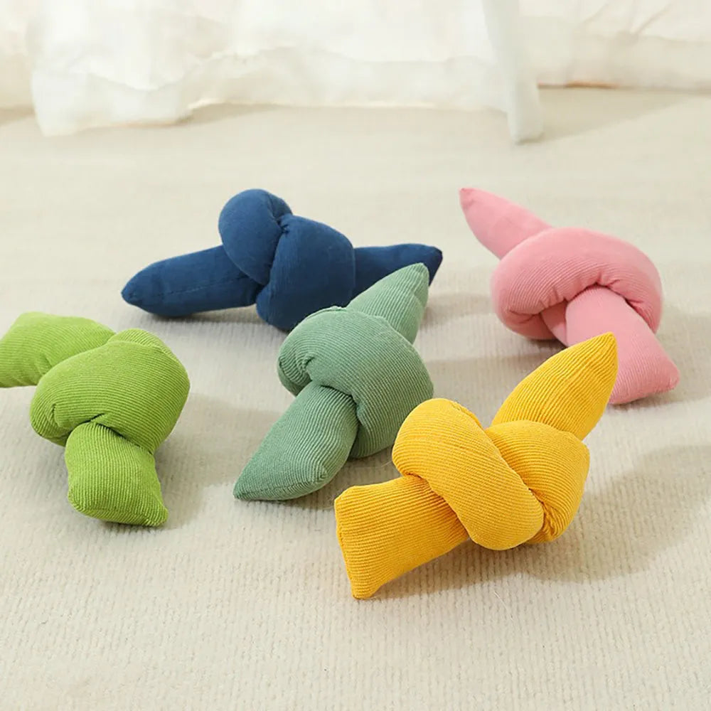 White cotton knotted dog rope toy for tugging and chewing games.