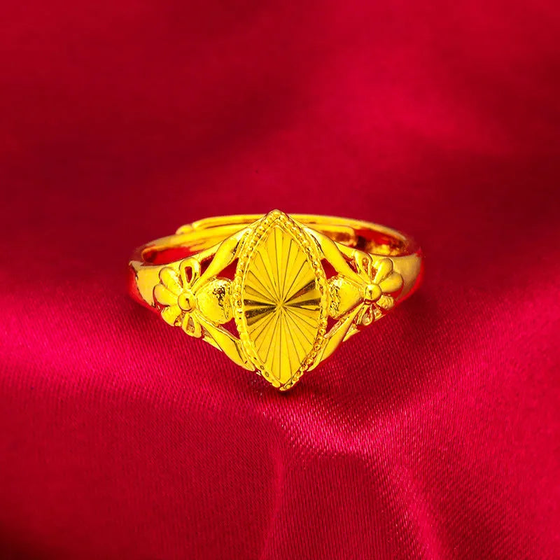 Gold electroplated open geometric flower ring with textured brass construction